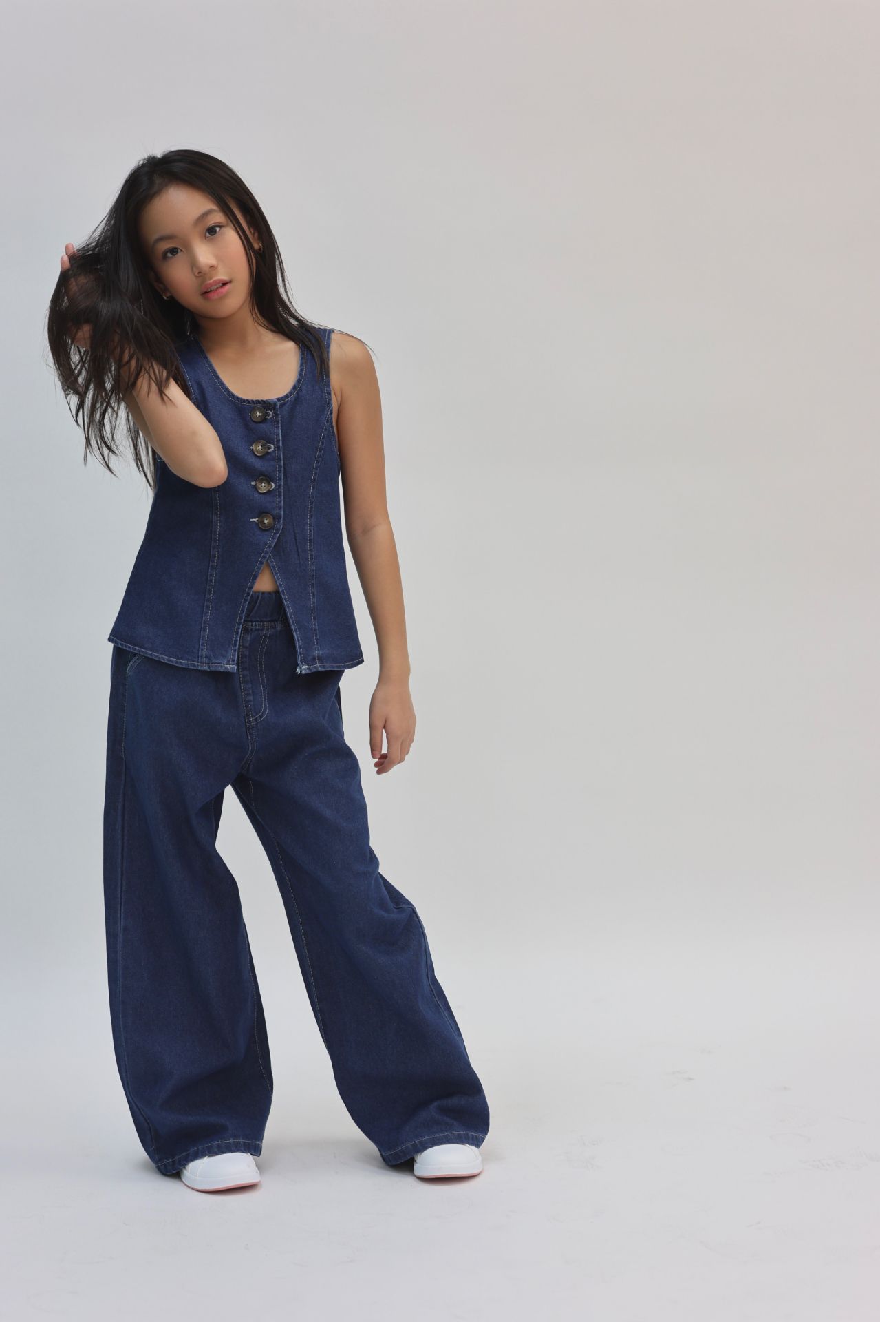 Denim vest and wide-leg jeans movement frame