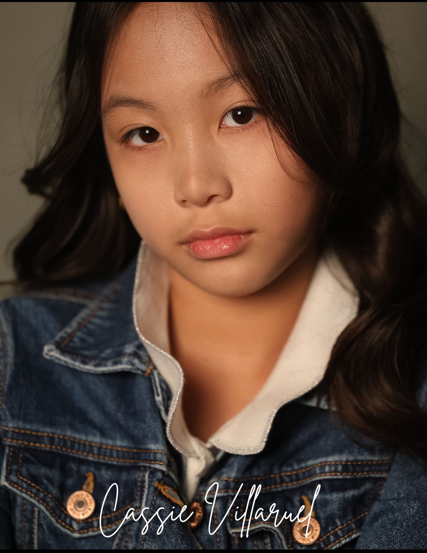 Natural close-up headshot, denim jacket, direct gaze