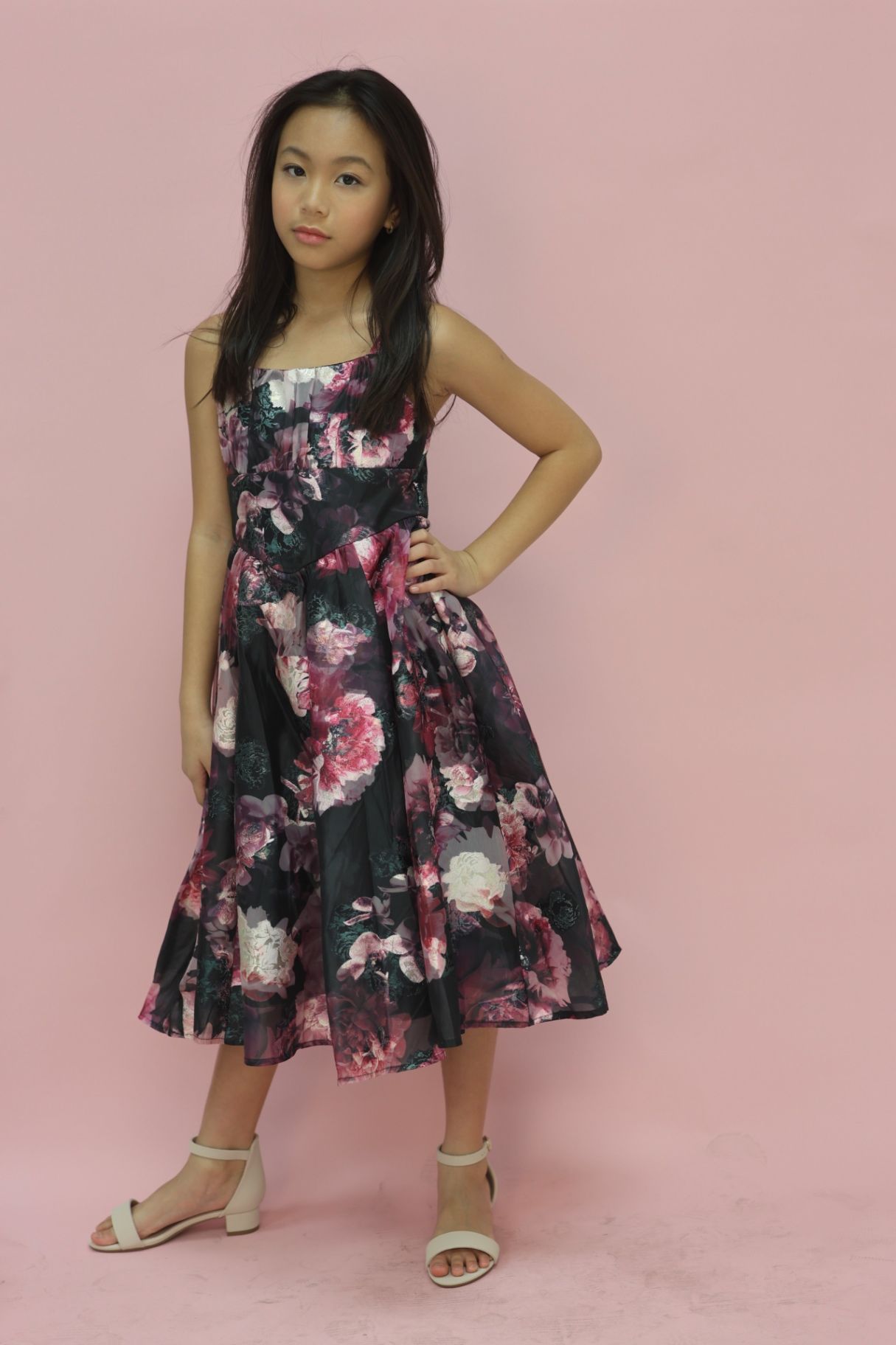 Editorial three-quarter pose in floral organza dress